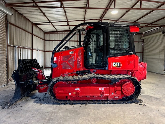 Red Pflugerville Fire Department Dozer 201 parked inside a metal building.